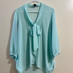 Blue blouse with ruffles and bow